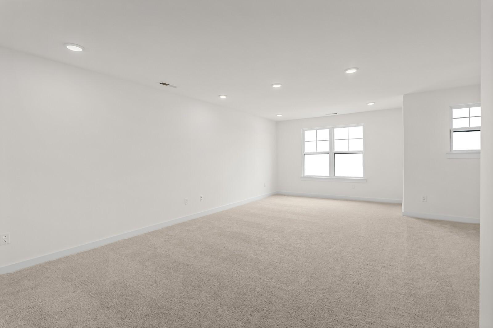 Spacious, carpeted bonus room with recessed lighting in The Ridgeport D floor plan at Benders Cove, Mt. Juliet, Tennessee.
