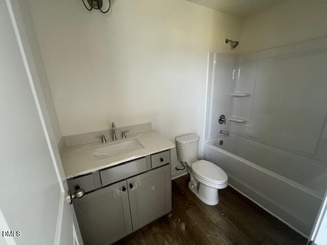 Full bathroom with gray vanity and tub-shower combo in The Hickory II B floor plan at Retreat at North Main, Lillington, NC.