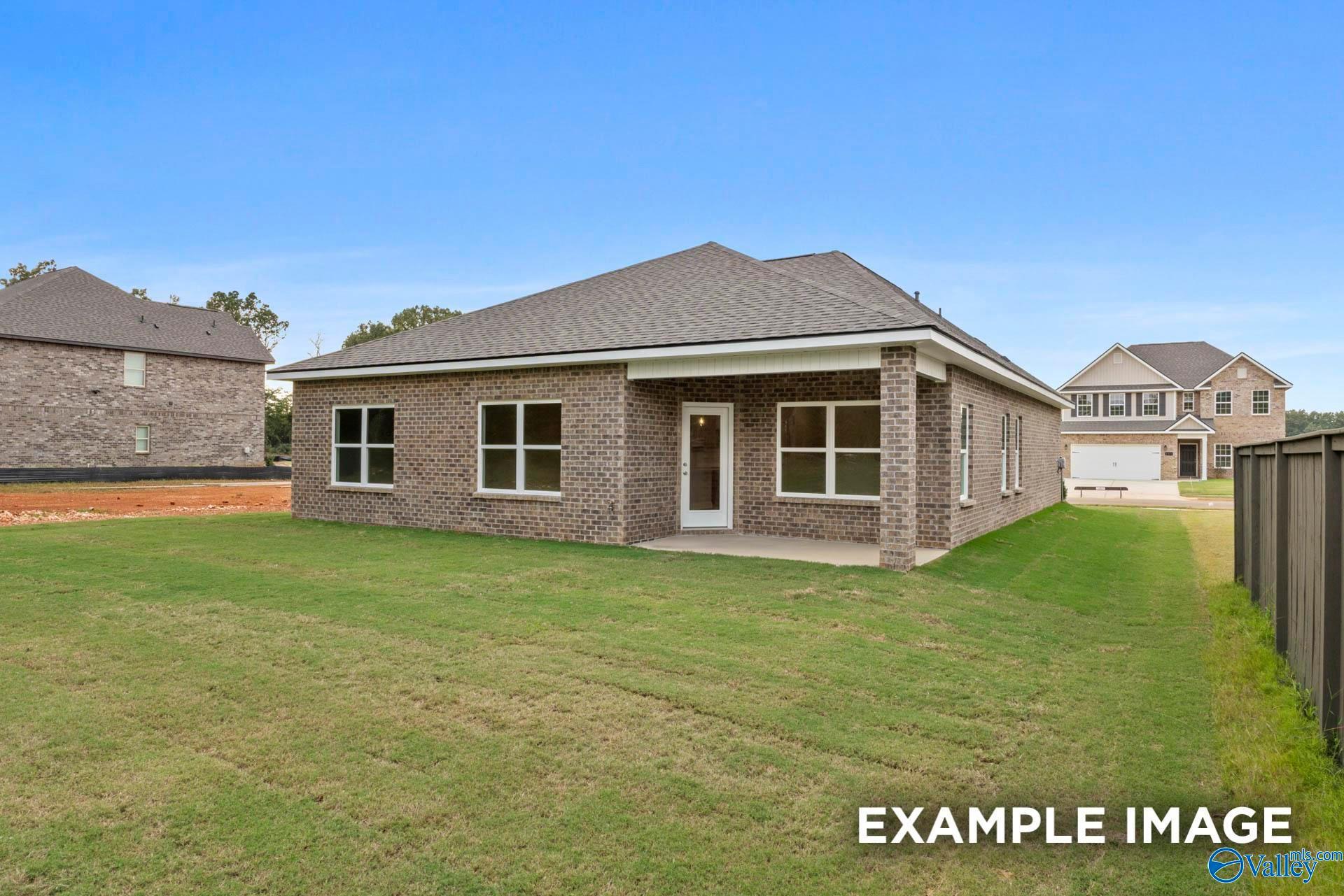 Rear exterior view of The Franklin C floor plan by Davidson Homes in Noble Ridge, Cullman, Alabama with a private backyard.