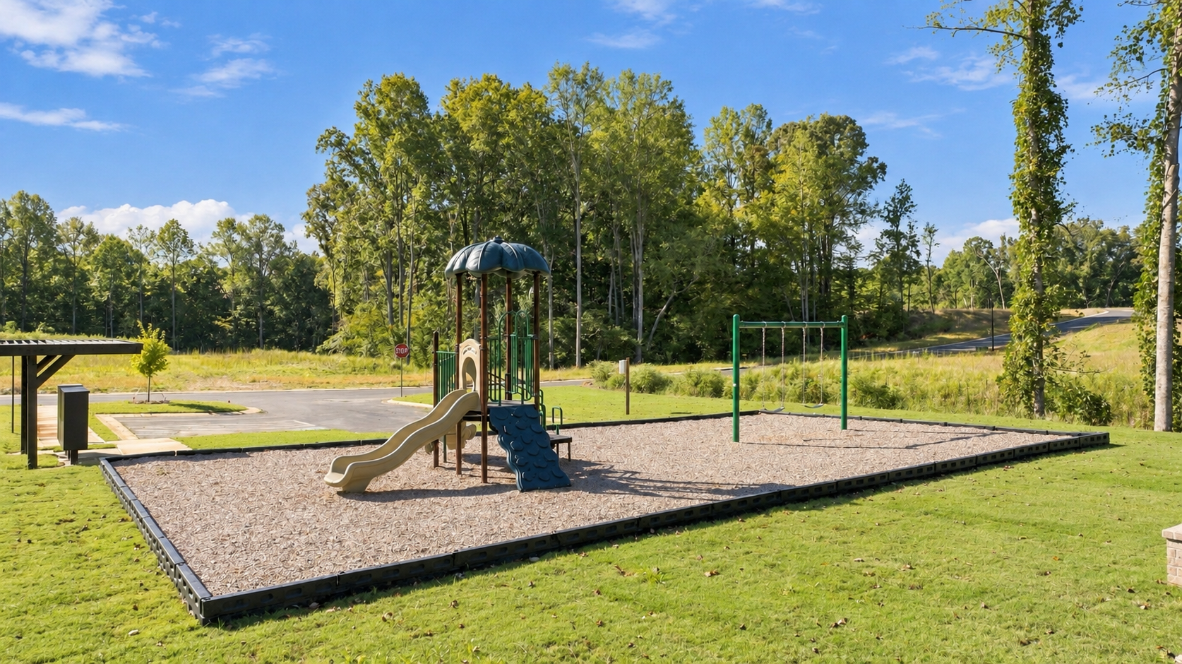 Community playground with slides and swings at Lake Hollow in Gainesville, Georgia by Davidson Homes