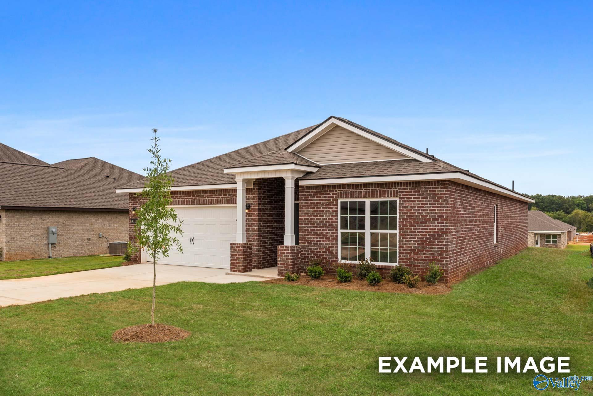 Brick 1-story home with 2-car garage, front porch, and landscaping in Ivy Hills, Toney, Alabama by Davidson Homes