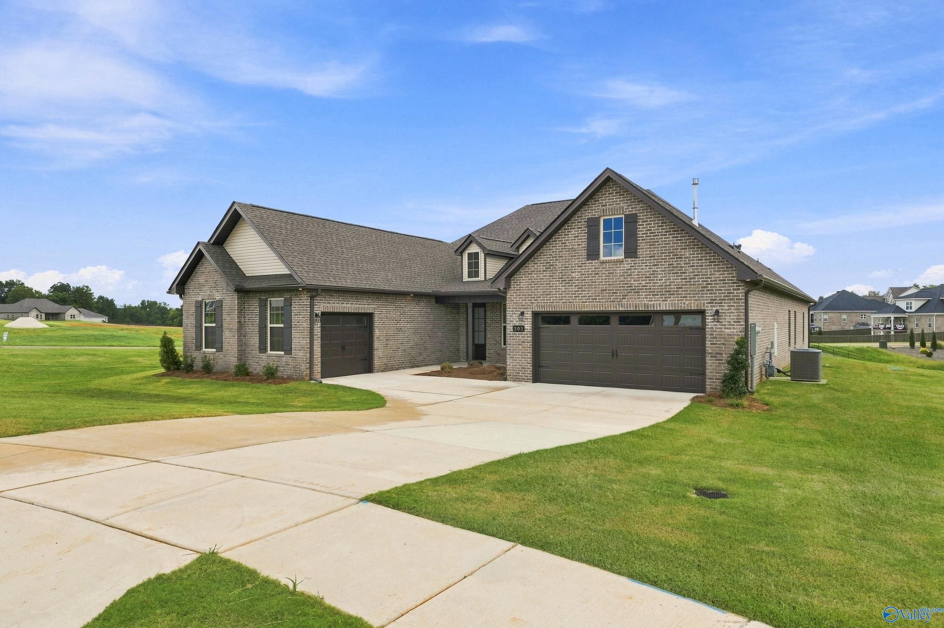 Single-story brick Valencia floor plan by Davidson Homes with 3-car garage in Riverton Preserve, Huntsville, Alabama.