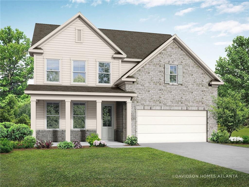 Two-story Hickory C floor plan by Davidson Homes with brick and siding exterior in Wehunt Meadows, Hoschton, Georgia.