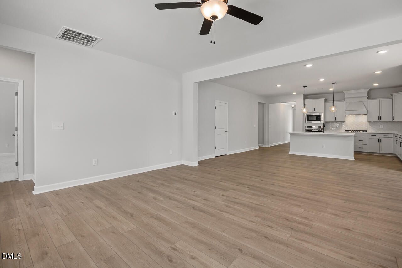 Open-concept living room and kitchen in The Birch II E floor plan at Sage on North Main, Wake Forest, North Carolina.