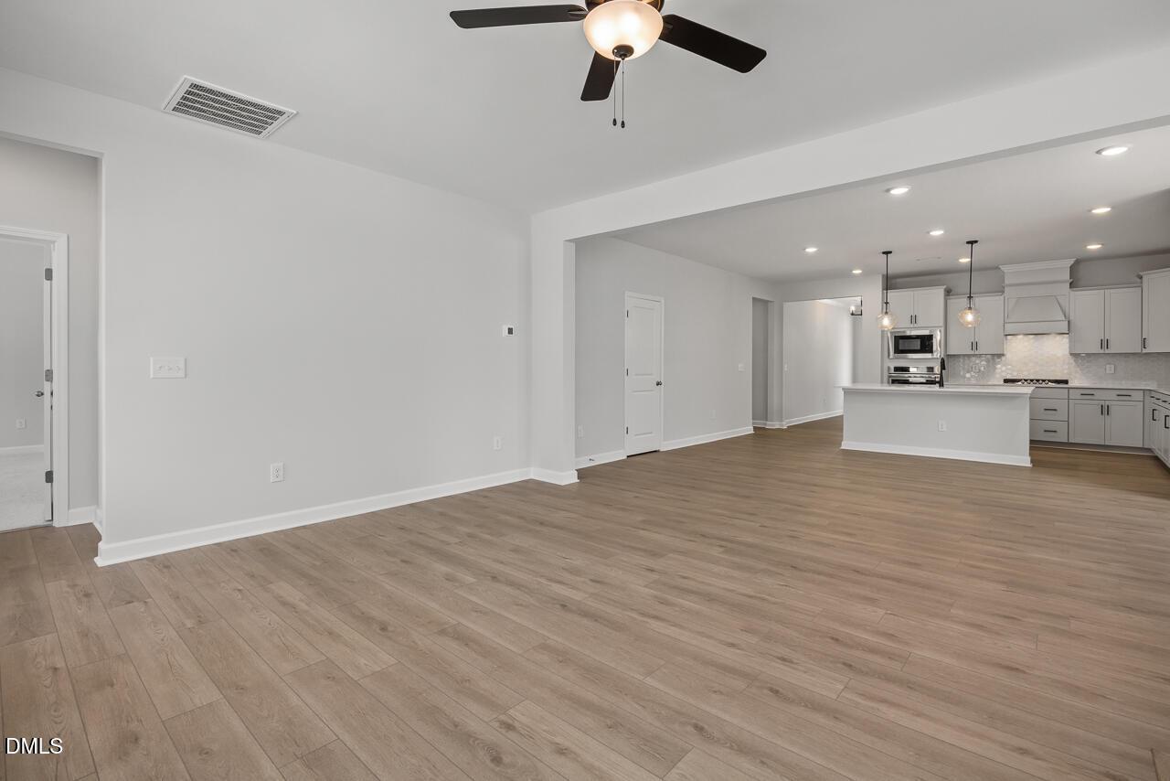 Open-concept living room and kitchen in The Birch II E floor plan at Sage on North Main, Wake Forest, North Carolina.