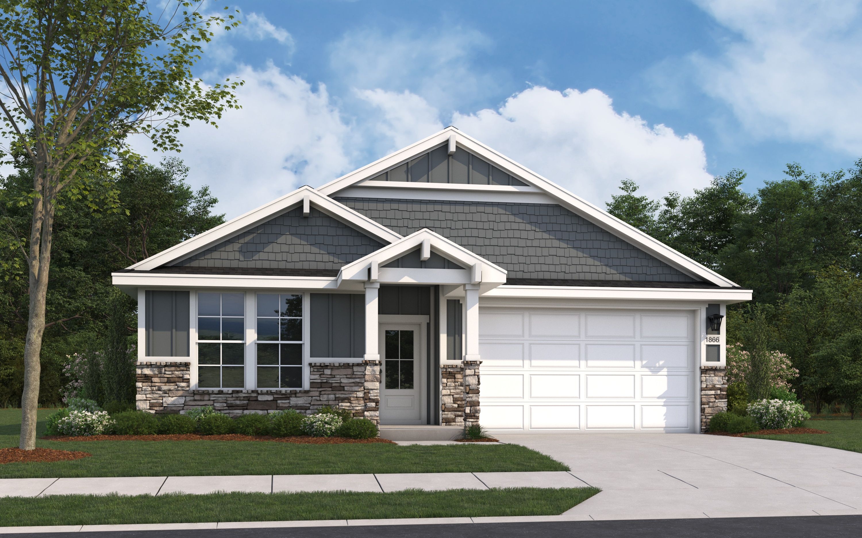 Craftsman-style elevation of The Aurora B single-story home featuring stone accents, shake shingles, two-car garage, and front porch landscaping