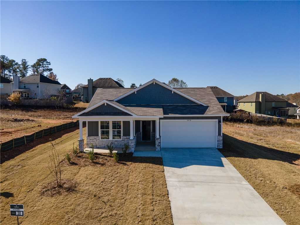 Modern gray single-story 4-bedroom home with 2-car garage and stone accents in Anderson Lakes, Opelika, Alabama - Davidson Homes Luna B