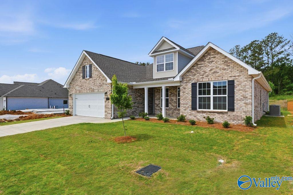 The Rockford with Bonus floor plan by Davidson Homes, a 1.5-story brick house for sale in Cain Park, Hartselle, Alabama.