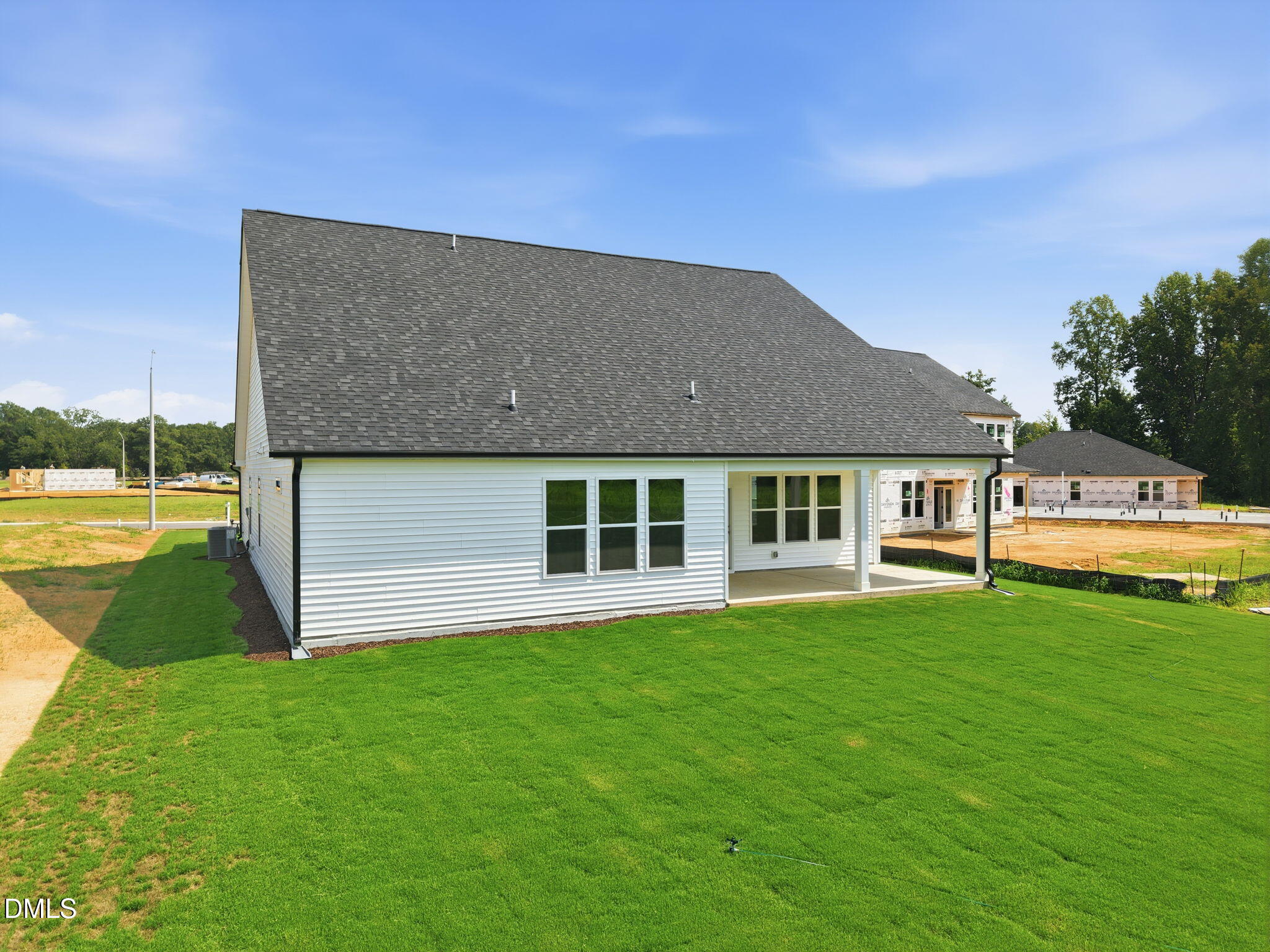 Back exterior view of The Magnolia B floor plan by Davidson Homes at Retreat at North Main in Lillington, North Carolina.