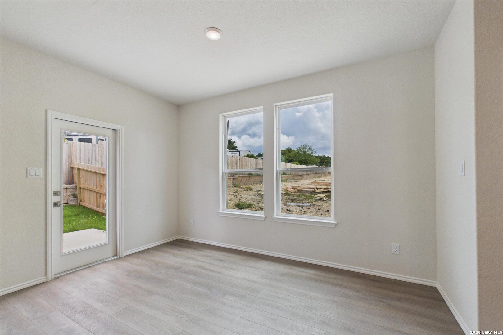 Bright breakfast nook with large windows and backyard access in The Charlotte B floor plan at Meadows at Oak Creek.