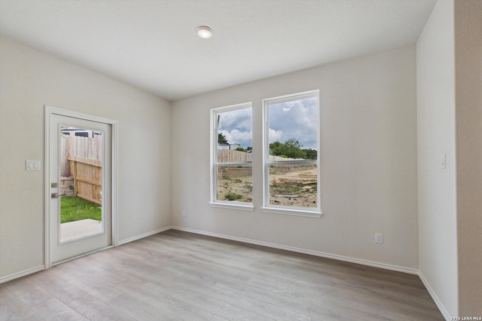 Bright breakfast nook with large windows and backyard access in The Charlotte B floor plan at Meadows at Oak Creek.