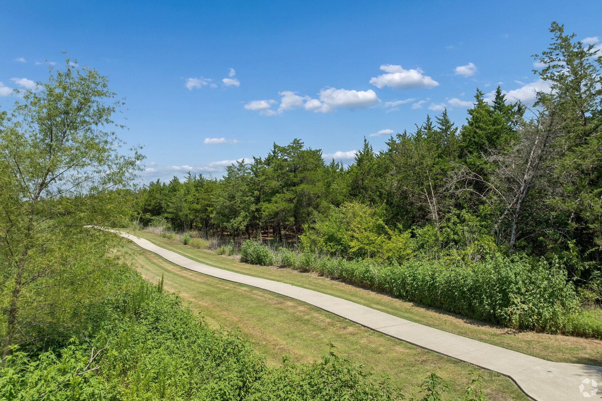 Tree-lined bike path for Mercer Meadows community in Royse City, TX
