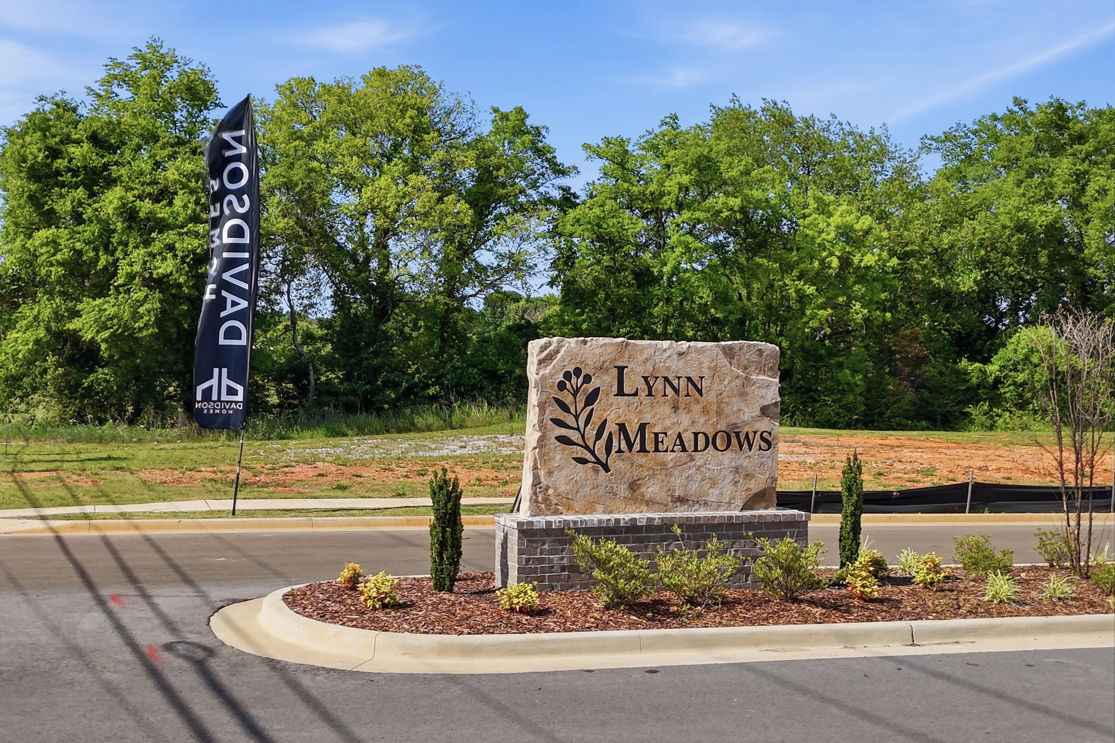 Stone entrance monument for Lynn Meadows community in Meridianville, Alabama, featuring Davidson Homes branding.