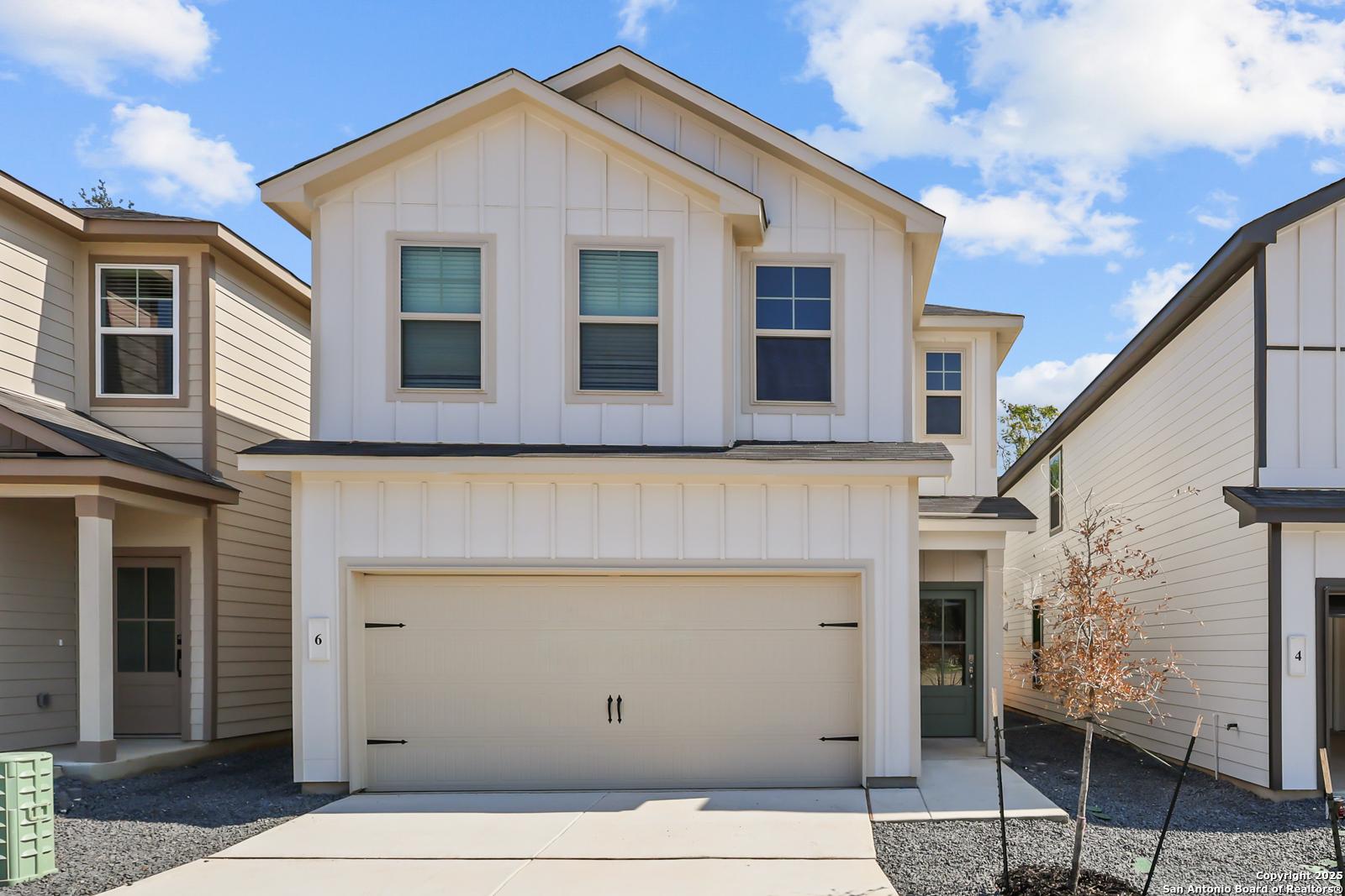 Modern two-story white home with 2-car garage by Davidson Homes, The Gillian C floor plan, Cedar Heights, San Antonio, Texas