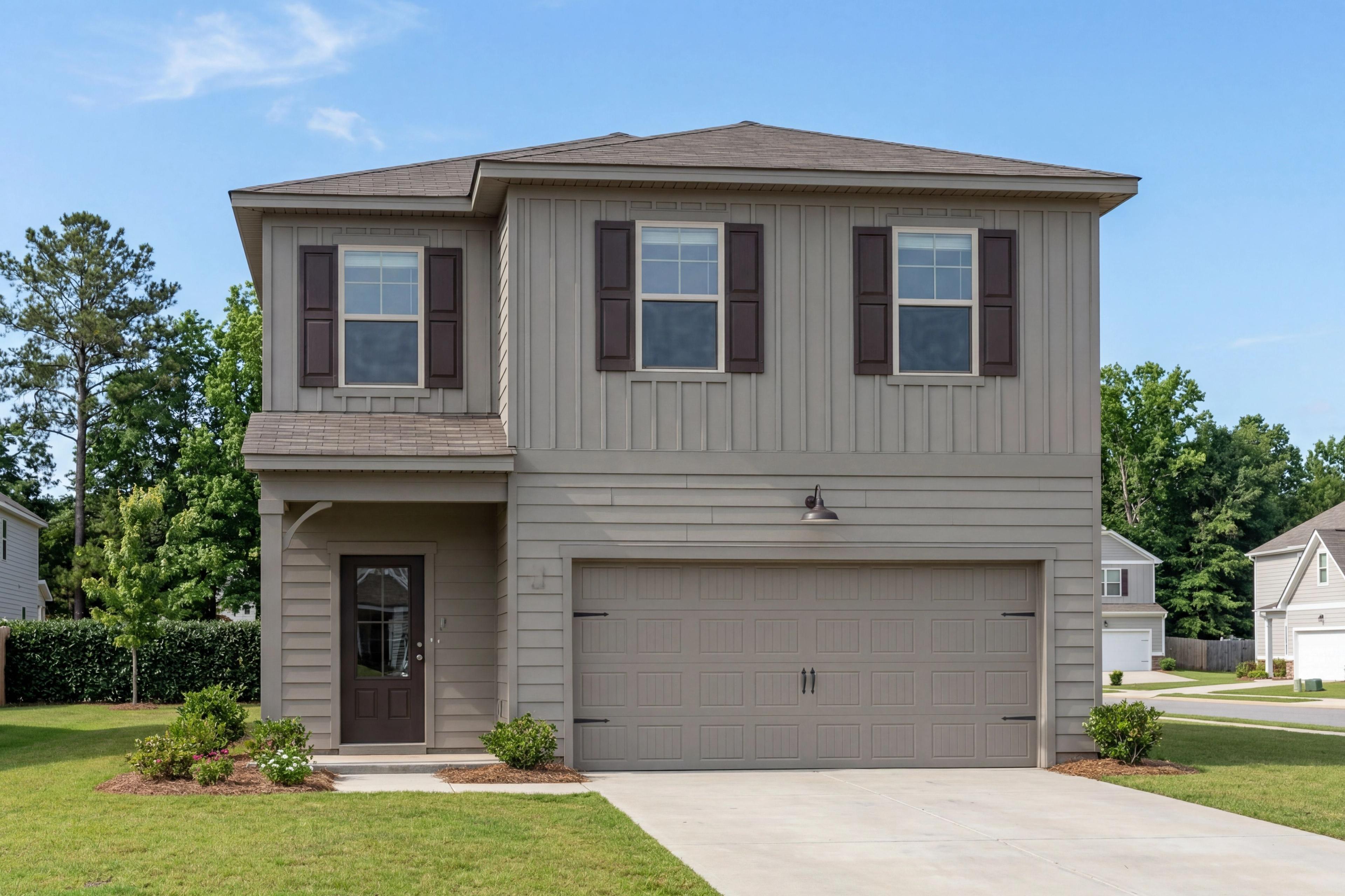 Two-story elevation of The Rabun A featuring board and batten siding, brown shutters, and a two-car garage.