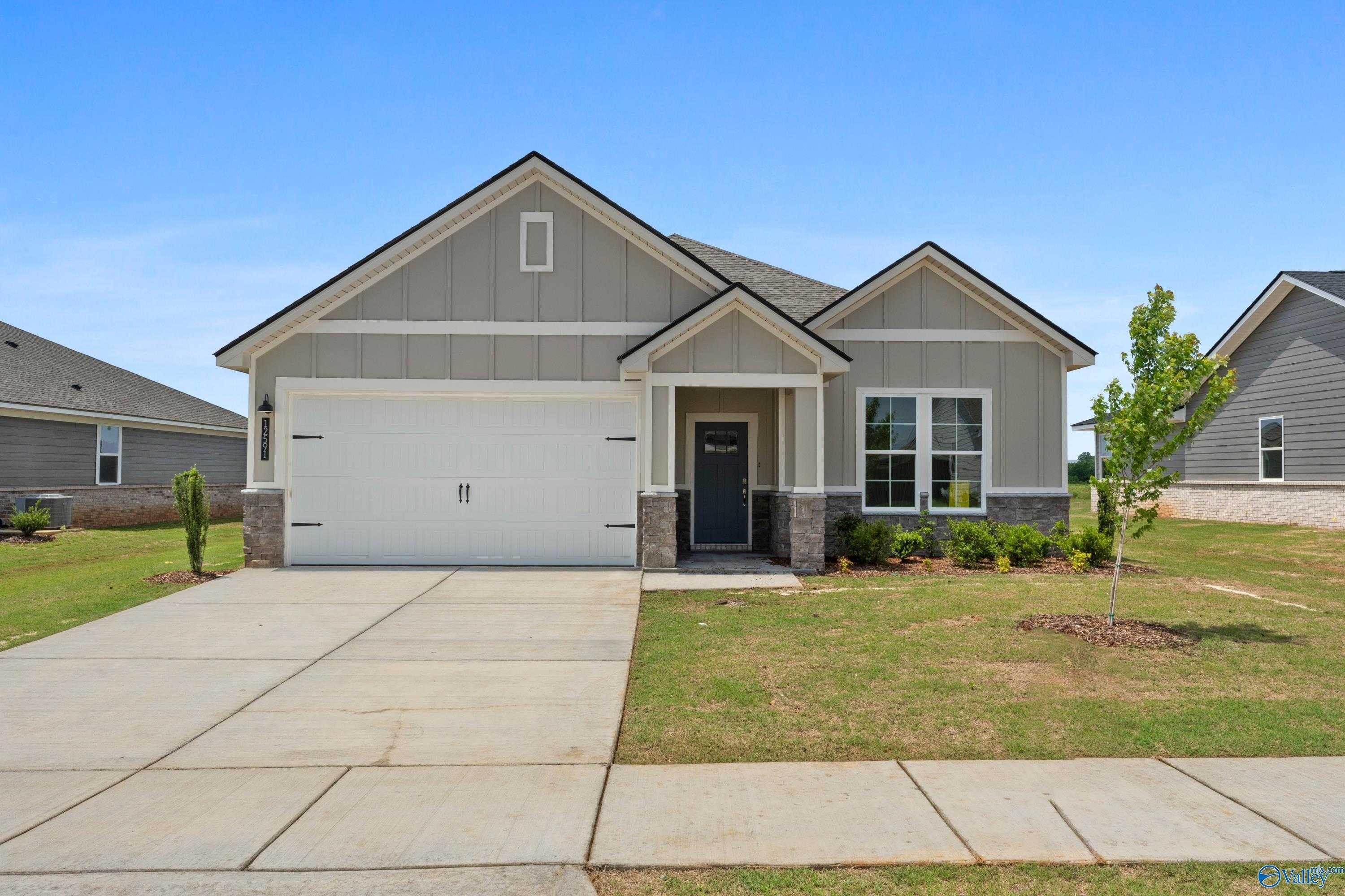 Modern gray single-story home with 2-car garage, driveway, and landscaped lawn in Anderson Farm, Athens, Alabama - Davidson Homes The Orion