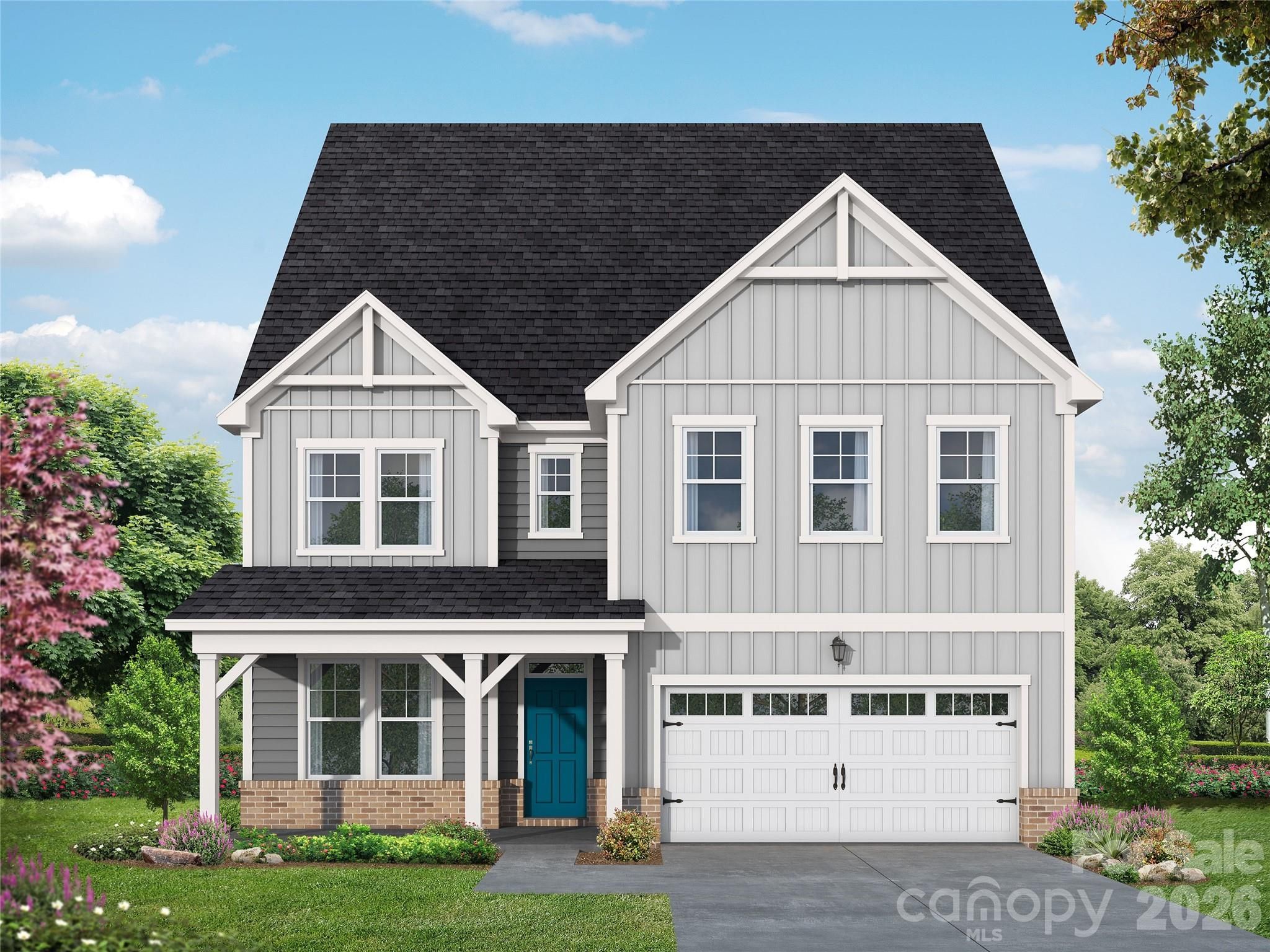 Two-story gray farmhouse-style home with teal front door, covered porch, and 2-car garage in The Aspen B floor plan, Windgate, Mooresville NC