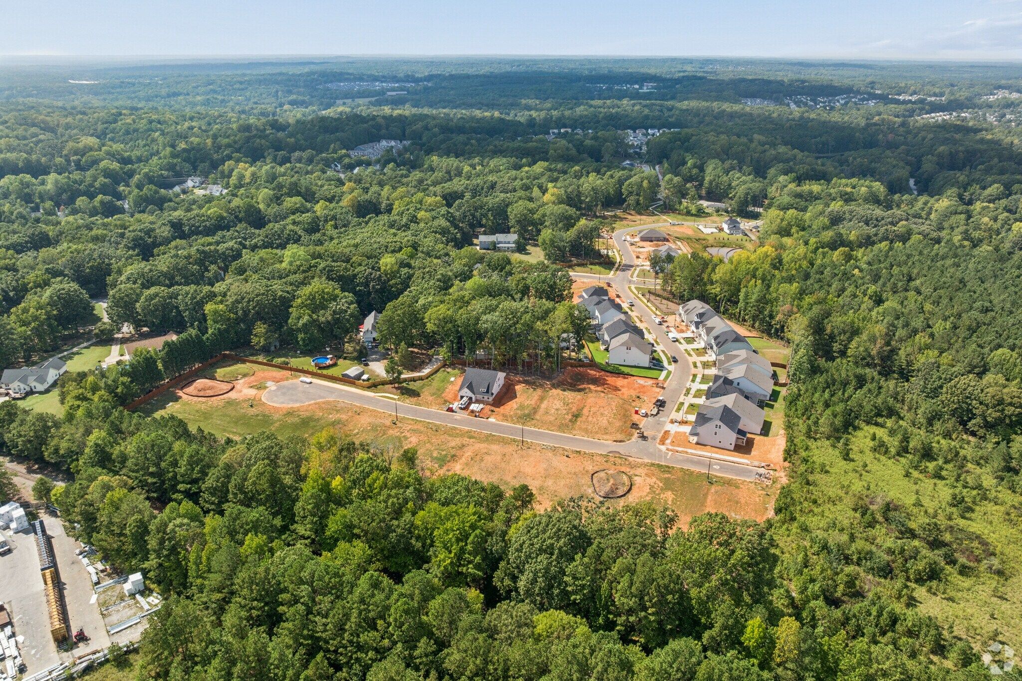 Aerial view of Sage on North Main community in Wake Forest, NC by Davidson Homes, new homes surrounded by lush trees
