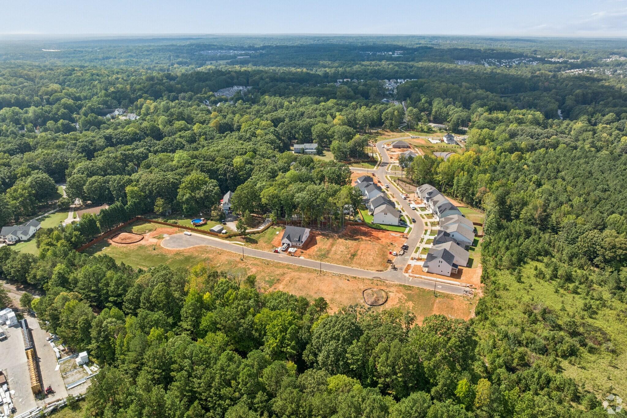 Aerial view of Sage on North Main community in Wake Forest, NC by Davidson Homes, new homes surrounded by lush trees