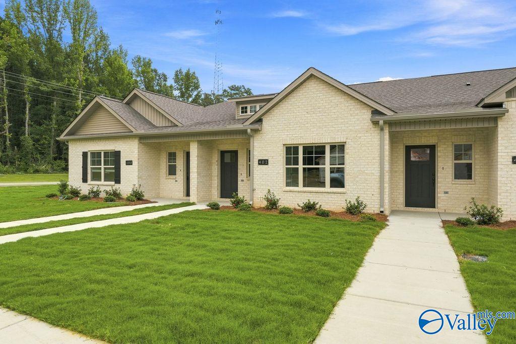 Cream brick exterior of The Camilla C floor plan at The Retreat at Cain Park in Hartselle, Alabama.