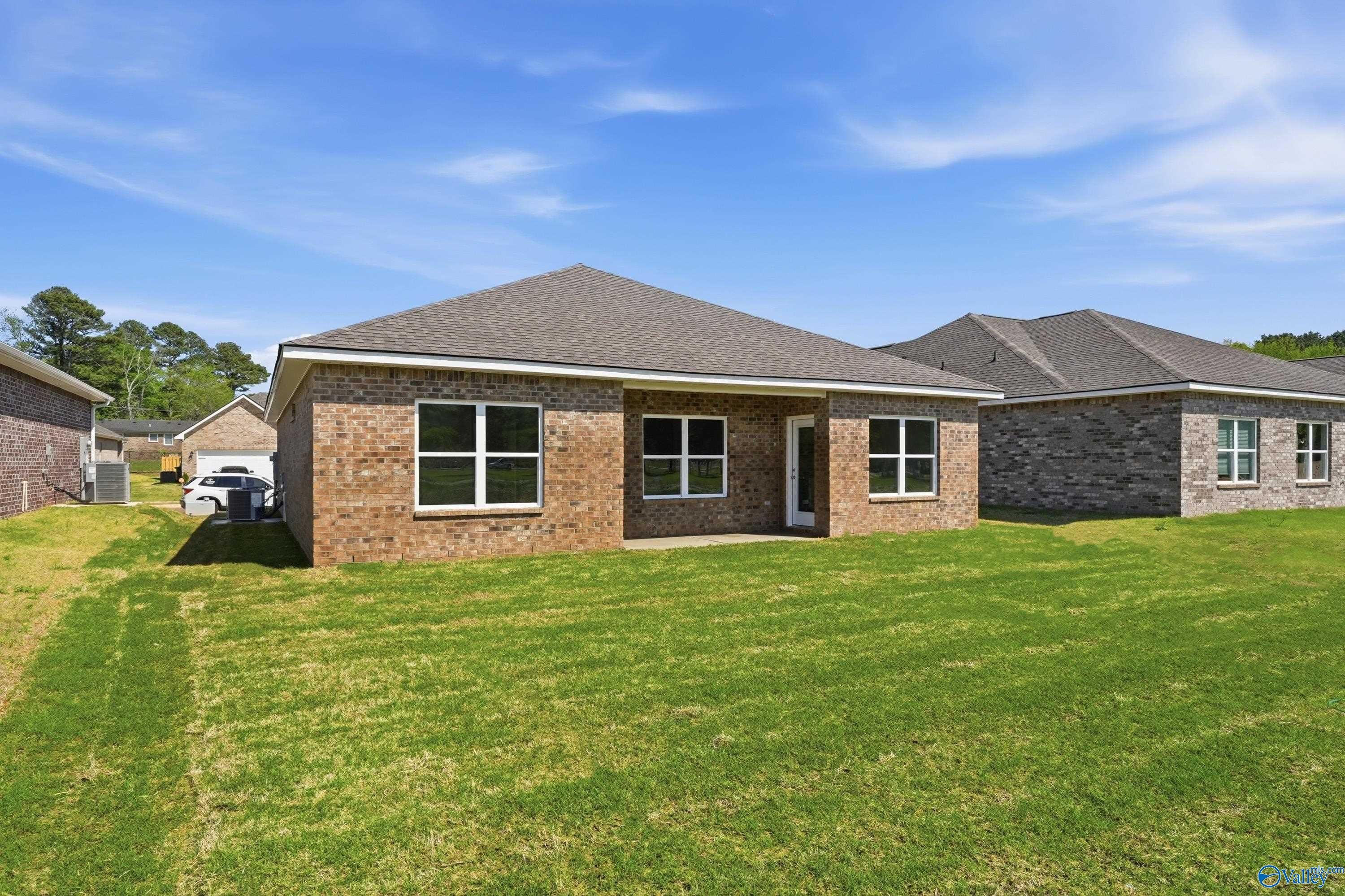 Rear brick exterior view of The Asheville floor plan home for sale in Jaguar Hills, Huntsville, Alabama.