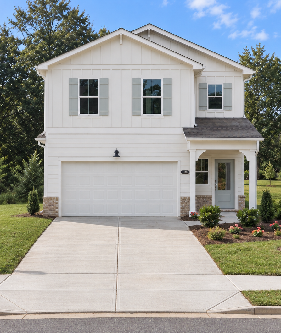 Modern white farmhouse exterior by Davidson Homes at Greene Farm in Cartersville, Georgia with two-car garage.