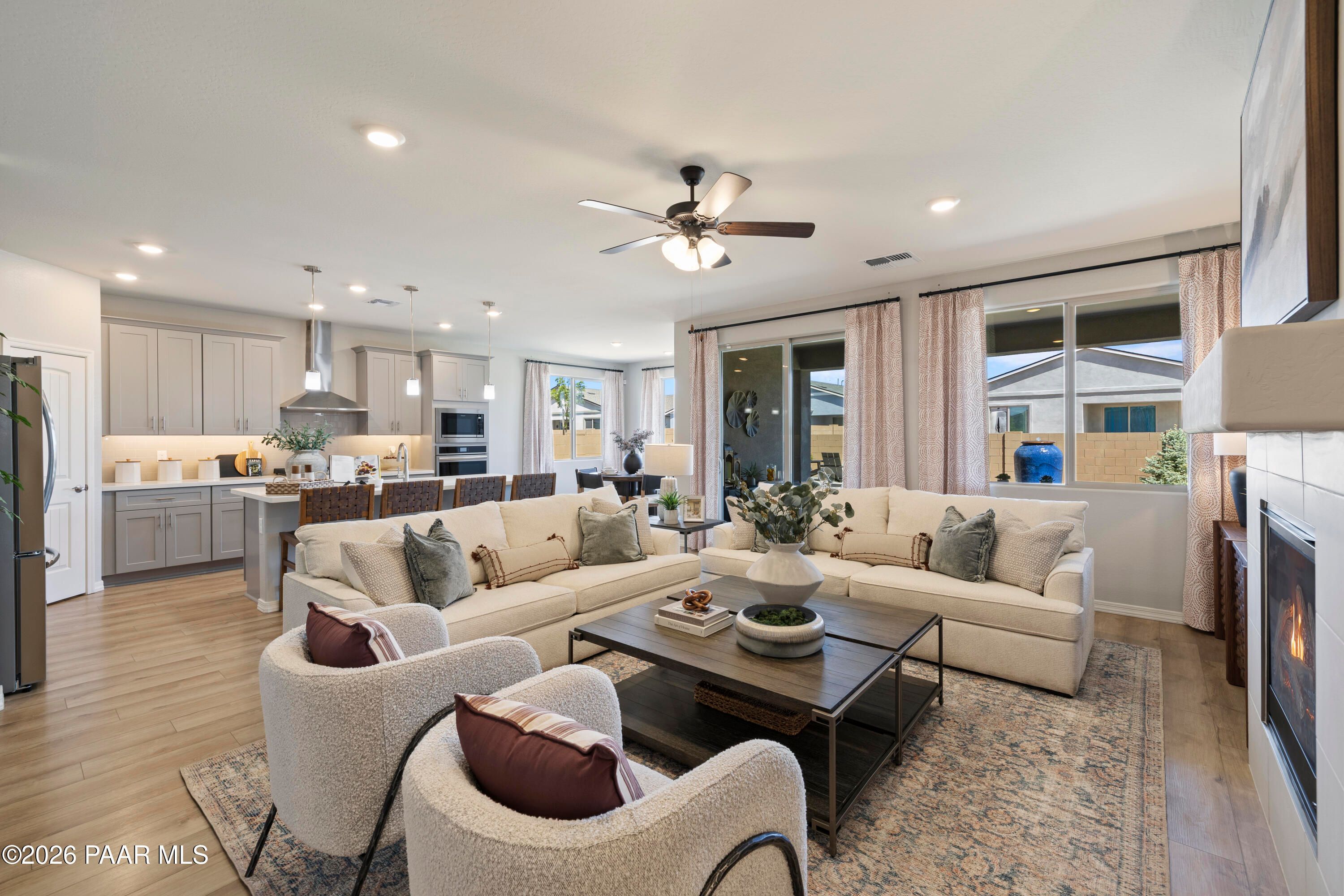 Open-concept living room and kitchen in The Harmony A floor plan at North Ridge, Pronghorn Ranch, Prescott Valley, AZ.