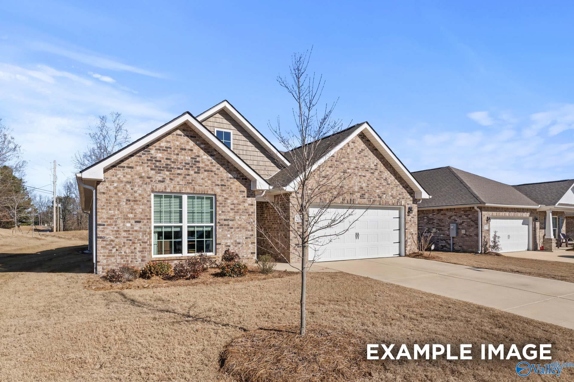 Brick ranch-style home with 2-car garage, gabled roof, and front landscaping in Flint Meadows, New Market, Alabama - Davidson Homes Franklin C