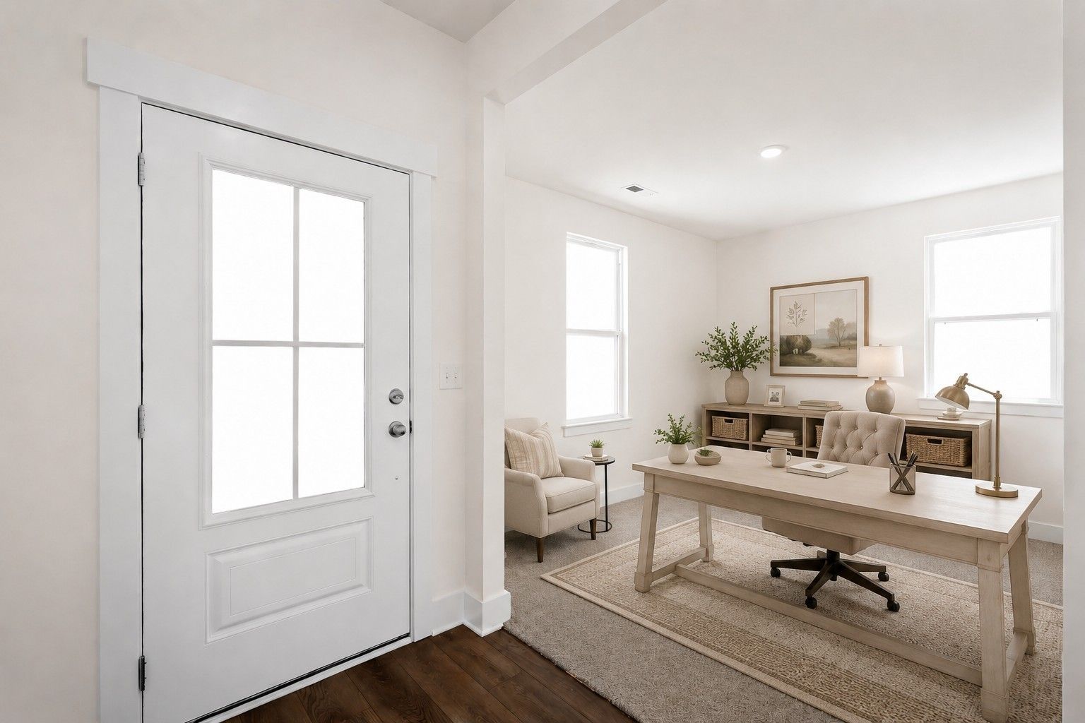 Bright home office with glass-panel front door, wooden desk and tufted chair in Davidson Homes Cottonwood E, Gallatin, TN