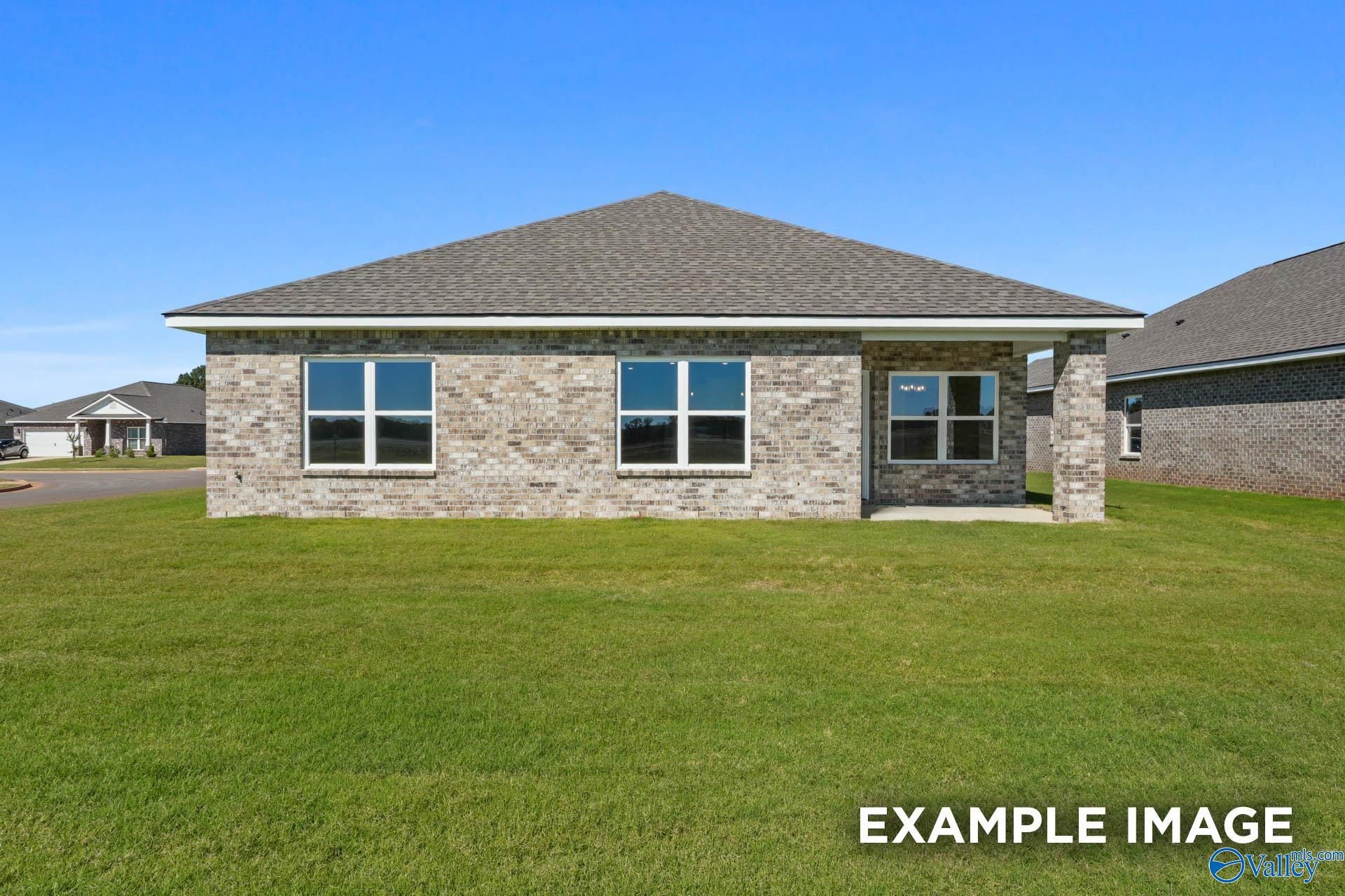 Brick single-story home with garage and large windows in Ricketts Farm, Athens, Alabama - The Daphne C by Davidson Homes