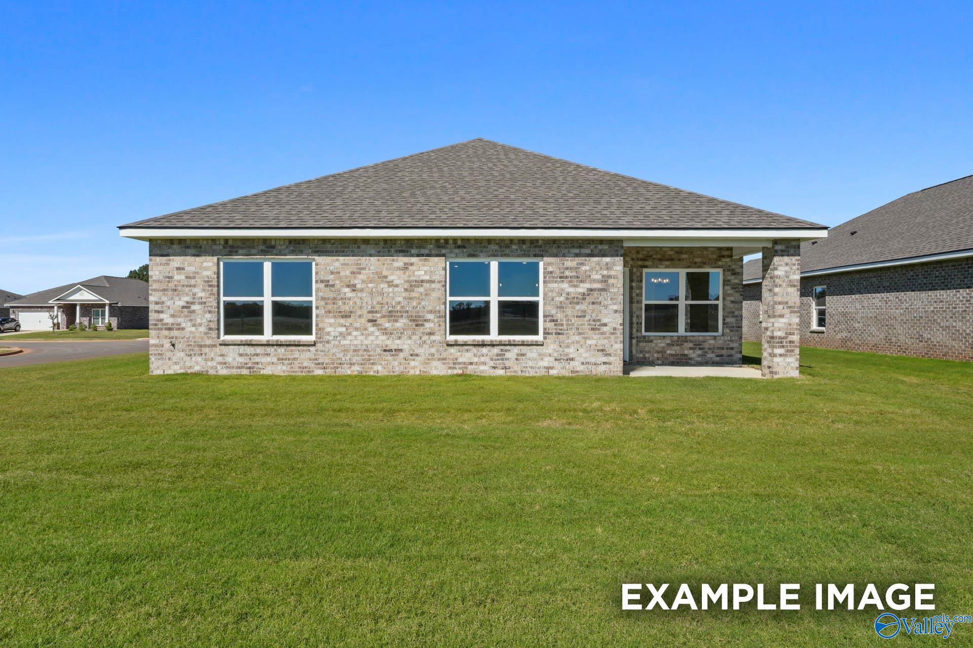 Brick single-story home with garage and large windows in Ricketts Farm, Athens, Alabama - The Daphne C by Davidson Homes