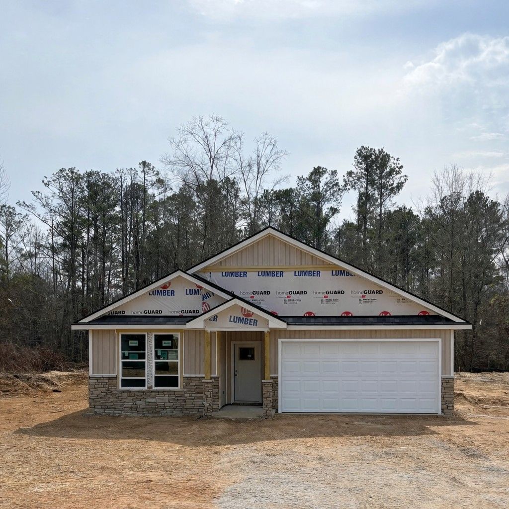 New construction 4-bedroom single-story home frame with 2-car garage and gable roof in Silver Oak, Cusseta, Alabama by Evermore Homes The Aurora B