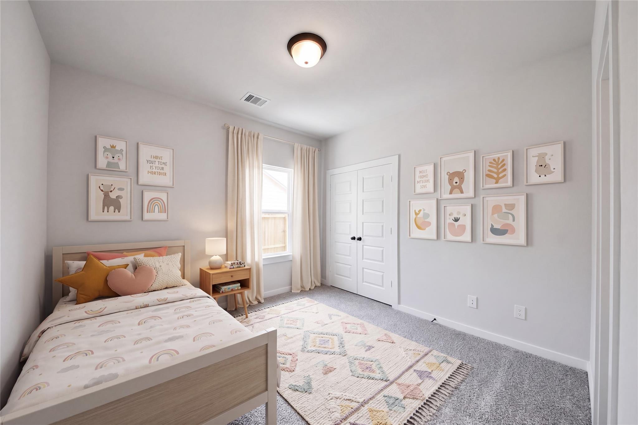 Cozy, decorated secondary bedroom in The Everett C floor plan at River Ranch Meadows, Dayton, Texas.