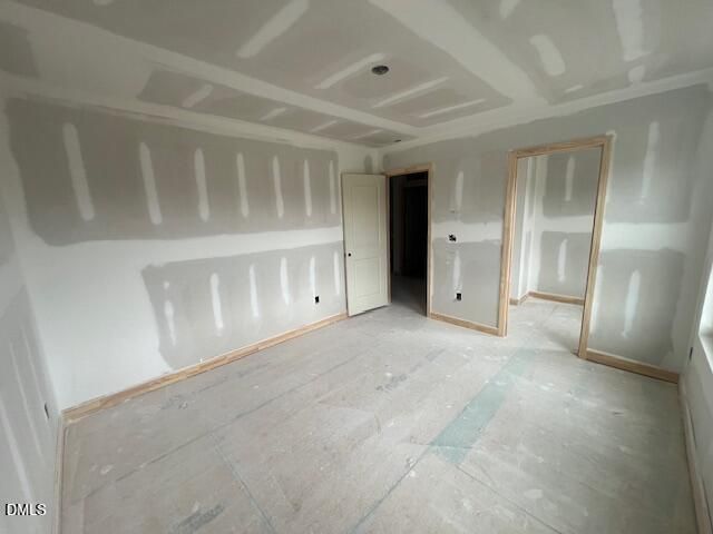 Unfinished bedroom with drywall in The Hickory II C floor plan at Retreat at North Main in Lillington, North Carolina.