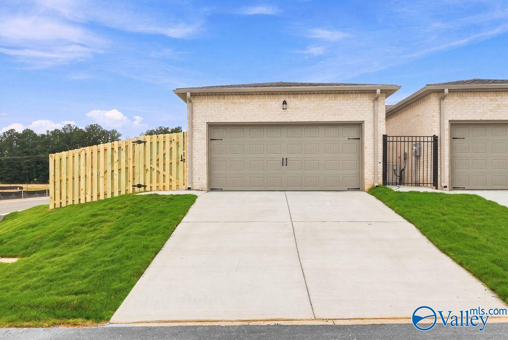 Two-car garage exterior of The Camilla B floor plan at The Retreat at Cain Park in Hartselle, Alabama.