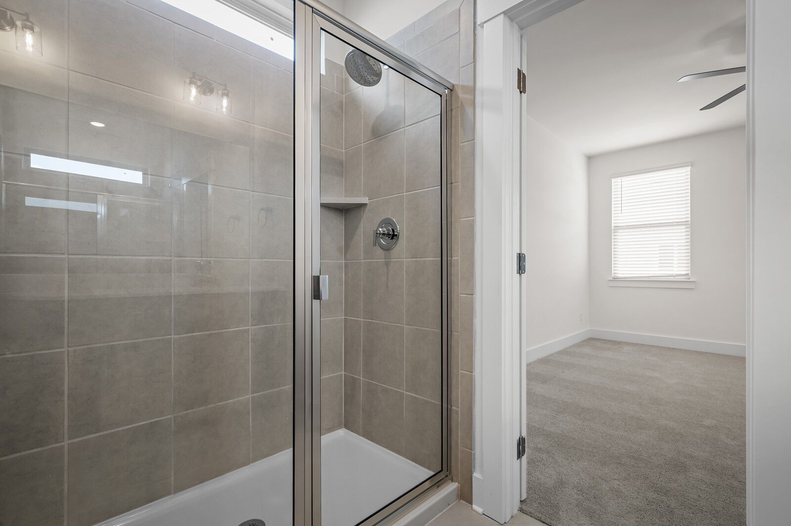 Tiled walk-in shower in The Ash A floor plan at Woods Crossing in Gallatin, Tennessee.