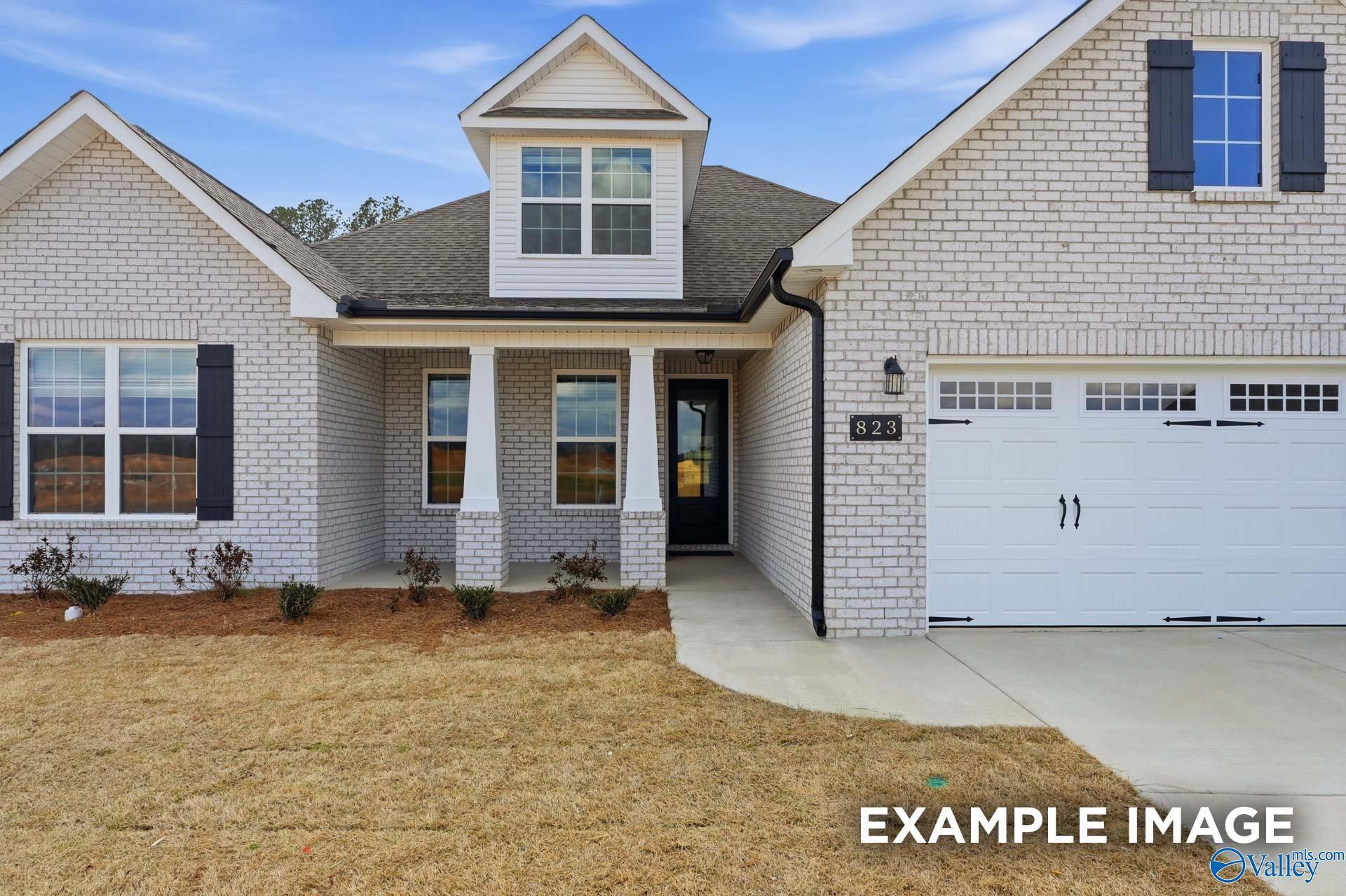 The Rockford floor plan by Davidson Homes featuring white brick exterior and 3-car garage in Briercreek, Meridianville, AL.