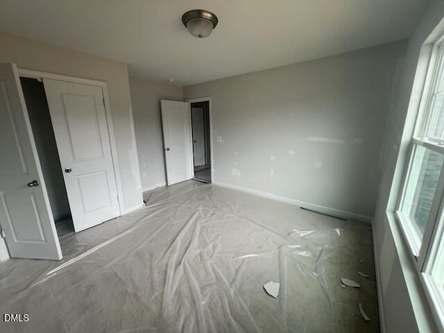 Unfinished secondary bedroom in The Ash B floor plan at Retreat at North Main, Lillington, North Carolina.