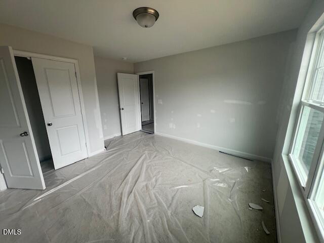 Unfinished secondary bedroom in The Ash B floor plan at Retreat at North Main, Lillington, North Carolina.