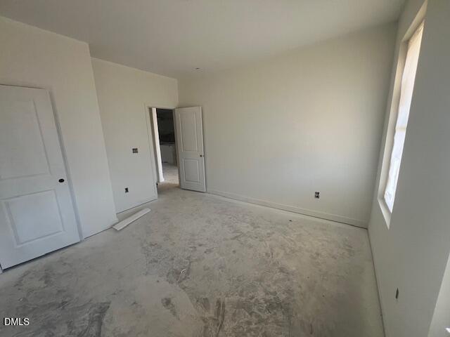Spacious unfinished bedroom with natural light in Davidson Homes Magnolia II B plan at Retreat at North Main, Lillington, NC