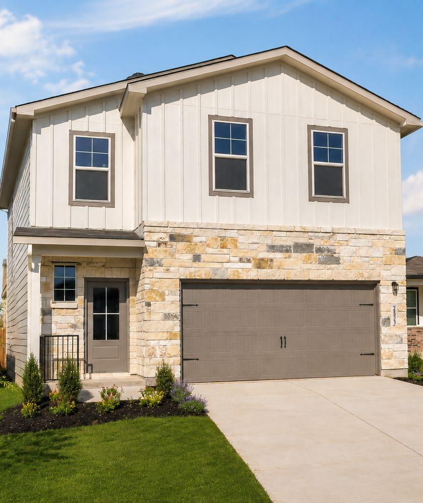 Two-story Davidson Homes exterior at Applewhite Meadows in San Antonio, TX, featuring stone accents and a two-car garage.