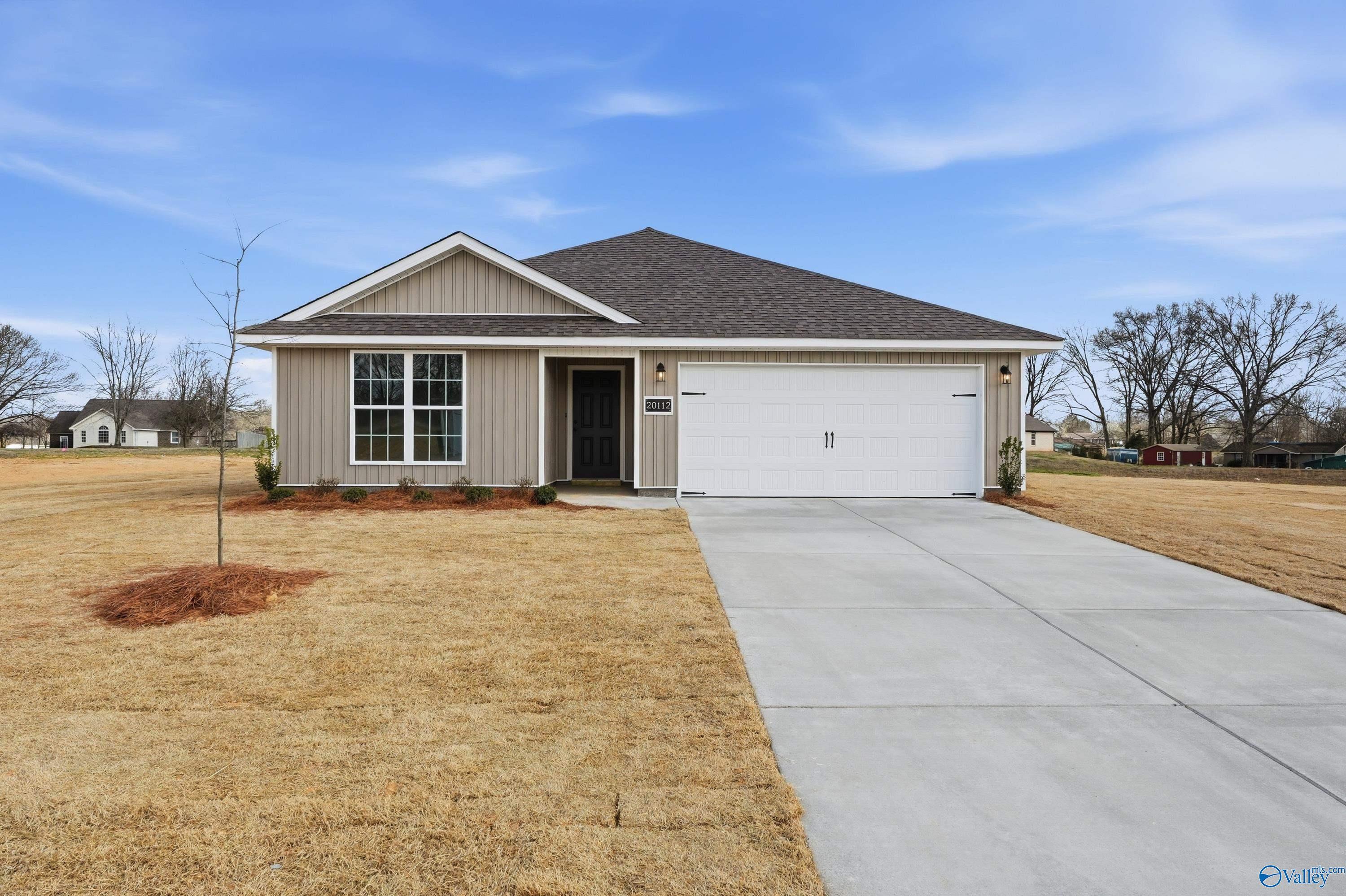 Modern gray-sided single-story home with 2-car garage, gabled roof, and landscaped front yard in Chapel Hill, Athens, Alabama - Davidson Homes Franklin V