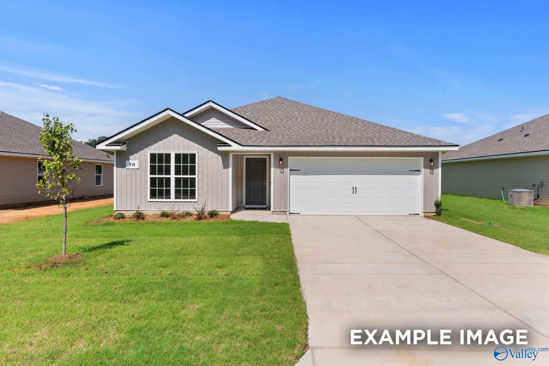 Contemporary gray single-story 3-bedroom home with 2-car garage, driveway, and landscaped lawn in Chapel Hill, Athens, Alabama
