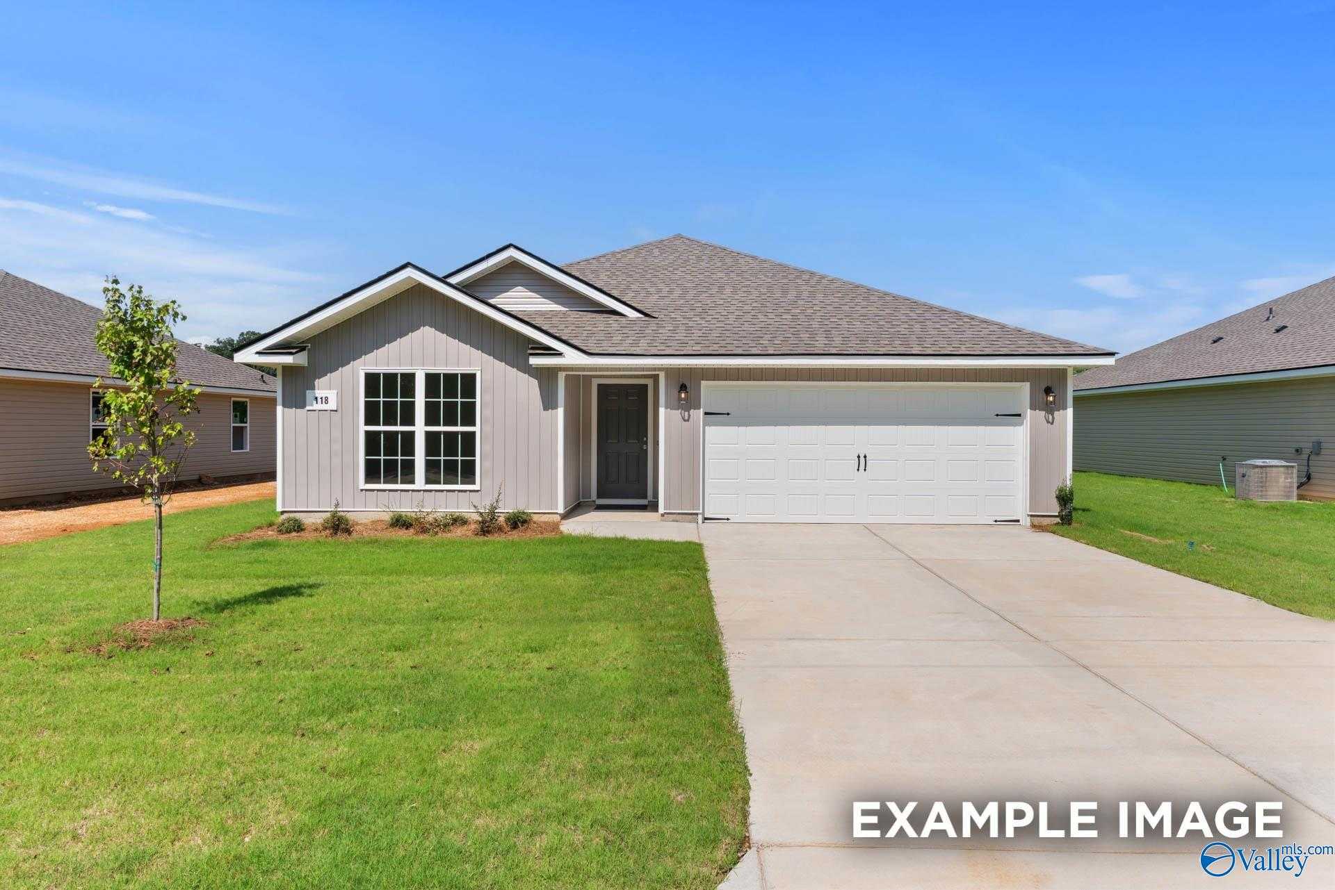 Contemporary gray single-story 3-bedroom home with 2-car garage, driveway, and landscaped lawn in Chapel Hill, Athens, Alabama