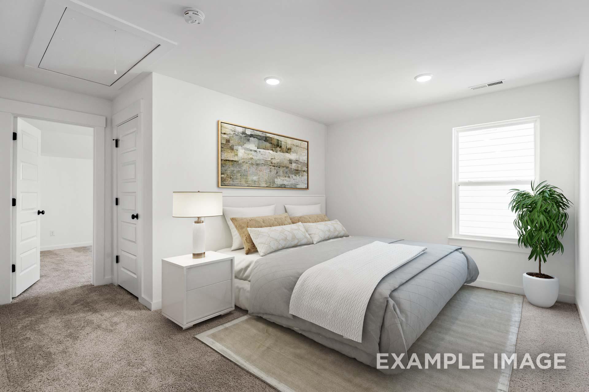 Spacious secondary bedroom in The Ash home with king bed, abstract wall art, nightstand lamp, and potted plant