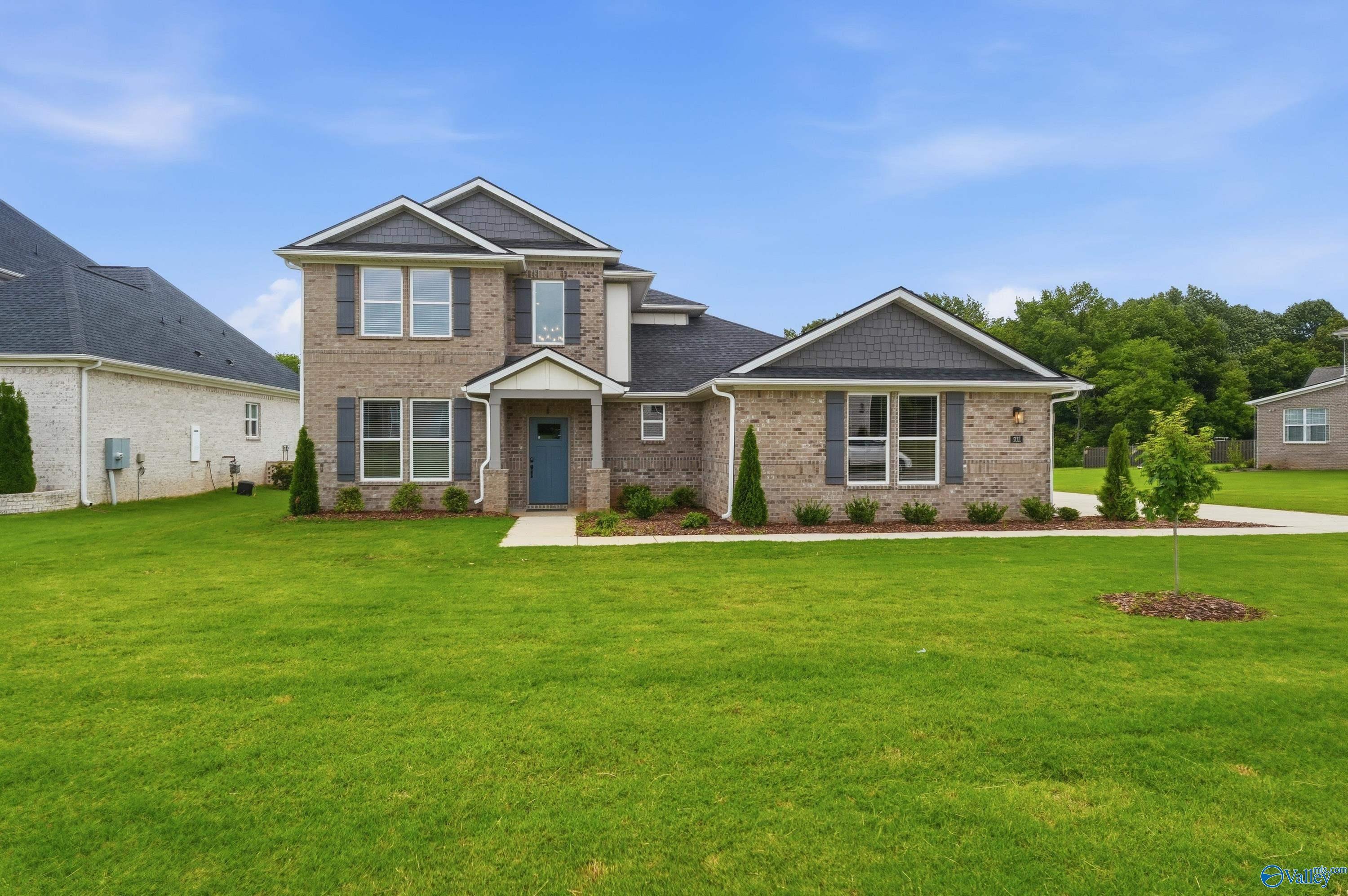 Two-story brick exterior of The Dorado floor plan by Davidson Homes in Riverton Preserve, Huntsville, Alabama.