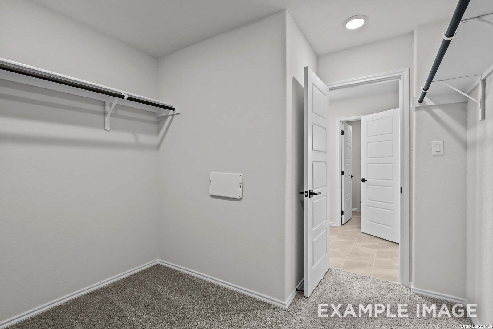 Spacious walk-in closet with shelving in The Florence D floor plan by Davidson Homes, Cedar Heights, San Antonio, Texas.