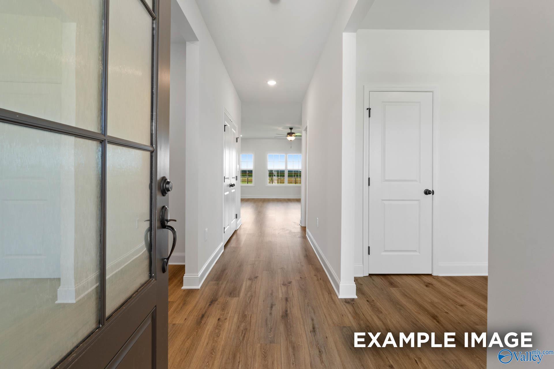 Bright foyer entrance with wood-look flooring in The Rockford B floor plan at Briercreek in Meridianville, Alabama.