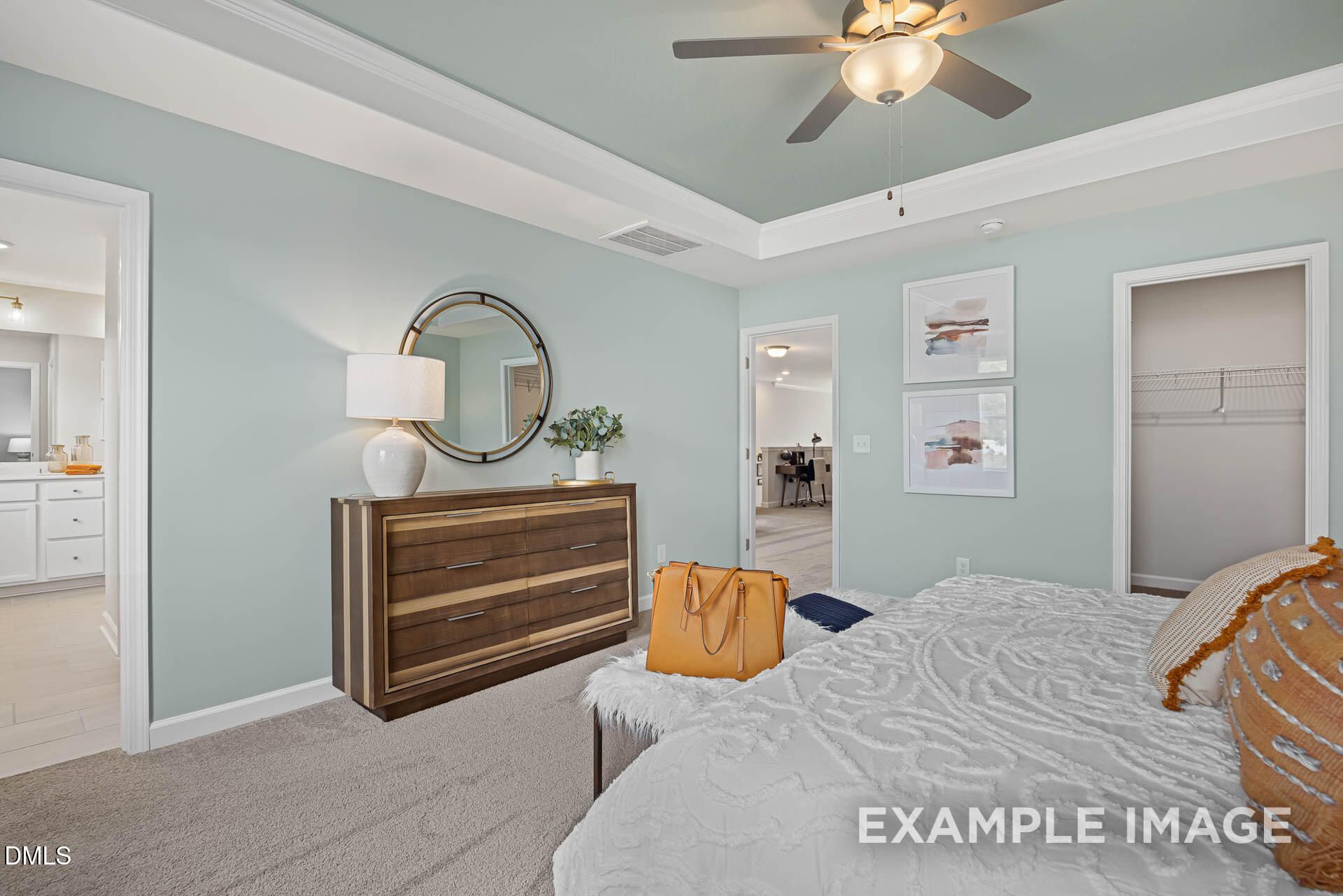 Spacious primary bedroom with tray ceiling in The Adalynn A floor plan by Davidson Homes in Zebulon, North Carolina.