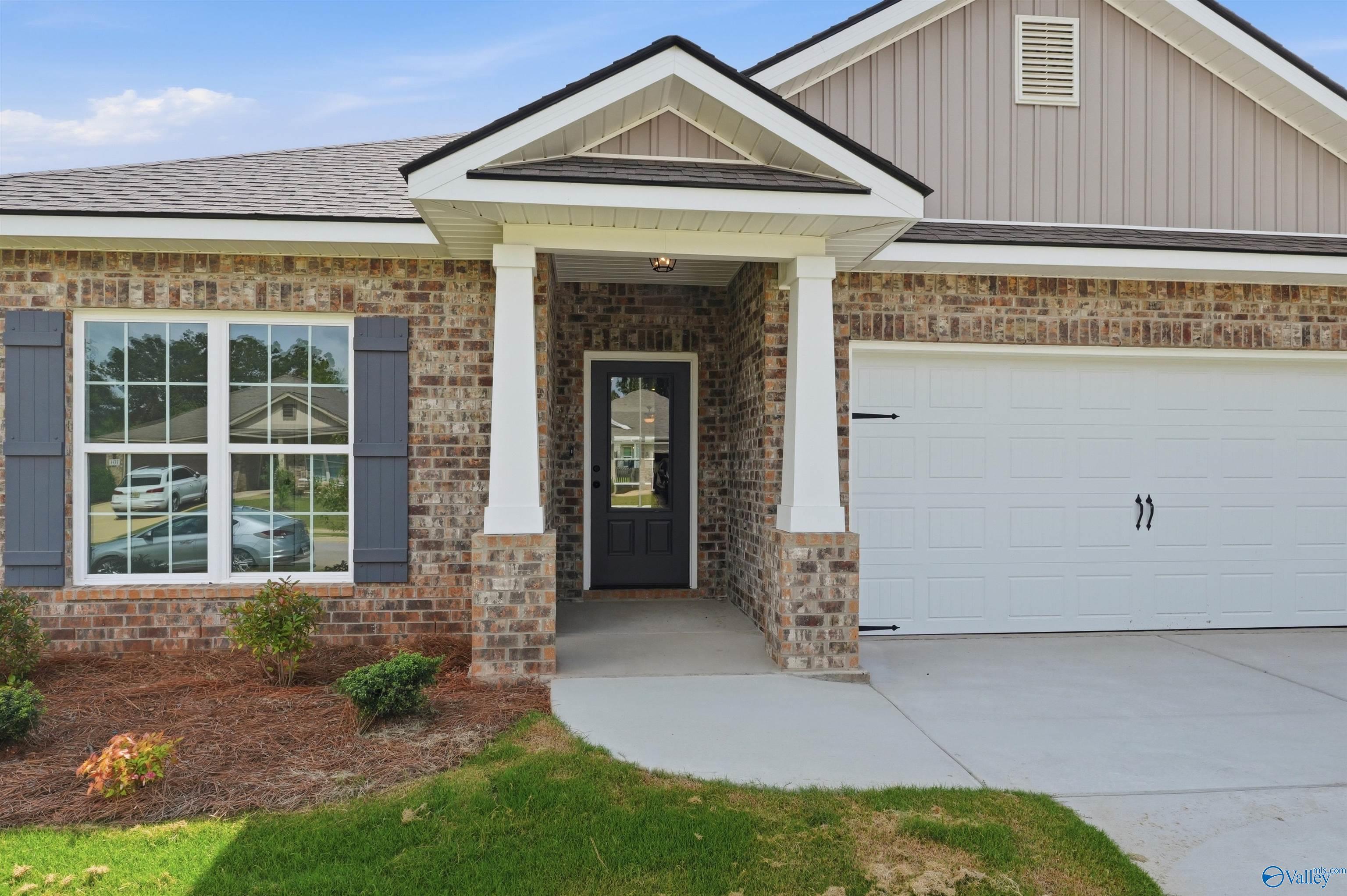 The Daphne C floor plan by Davidson Homes in Flint Meadows, New Market, Alabama featuring brick exterior and 2-car garage.